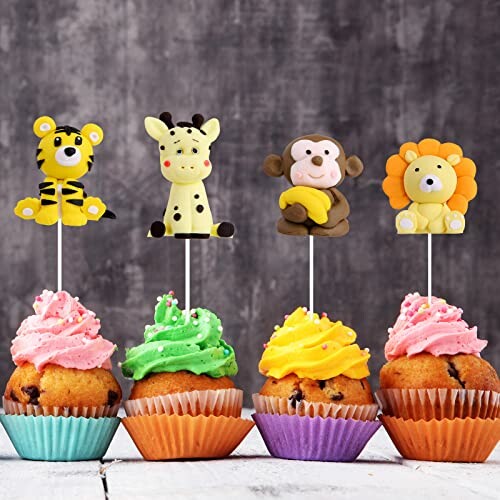 Cupcakes met dierlijke decoraties op stokjes