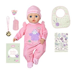 Babypop met accessoires zoals speen en slabbetje