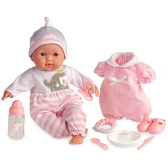 Babypop met accessoires, inclusief kleding en fles.