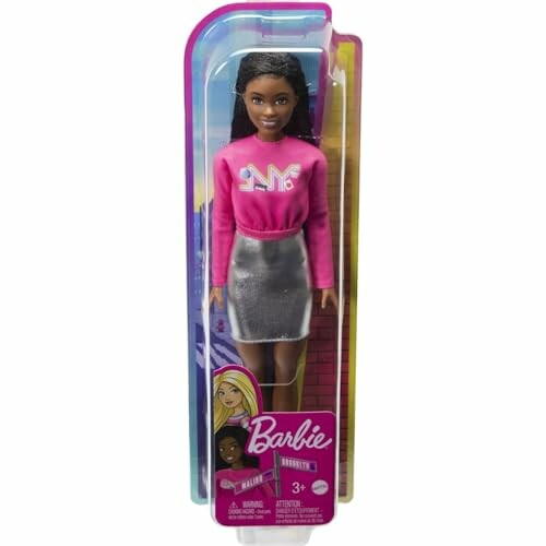 Barbie-pop in verpakking met roze trui en zilveren rok