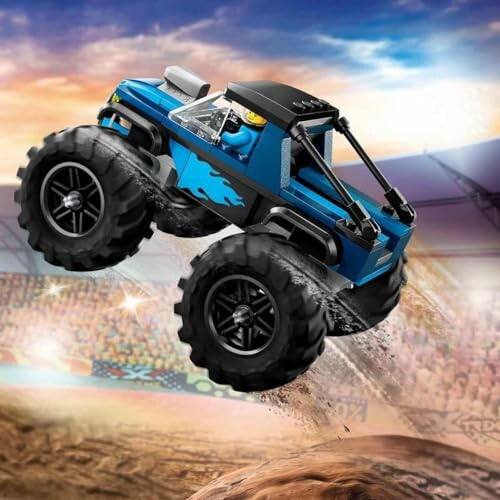 Blauwe monstertruck springt in een stadion.