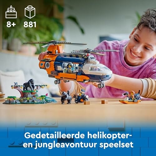 Kind speelt met LEGO helikopter en jungledieren