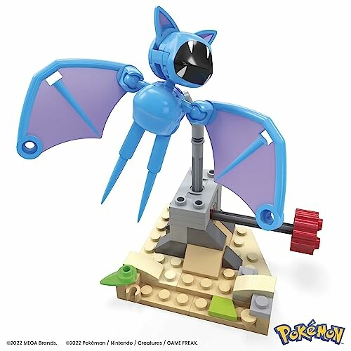 Blauwe Pokémon-figuur met vleugels op bouwstenen