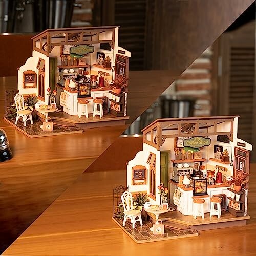 Miniatuur koffiehuis model met meubels en decoraties.