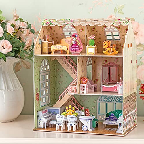 Miniatuur poppenhuis met meubels en decoraties