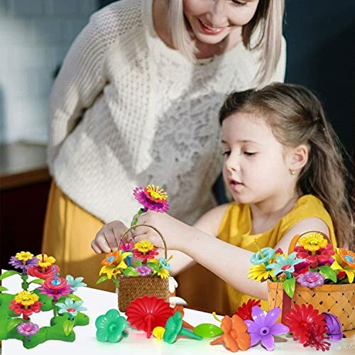 Moeder en dochter spelen met kleurrijke bloemenspeelgoed.