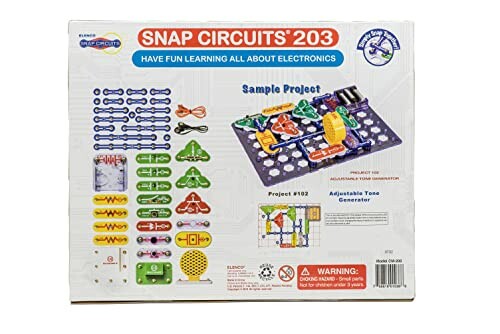 Achterkant van Snap Circuits 203 elektronica kit met voorbeelden en onderdelen.