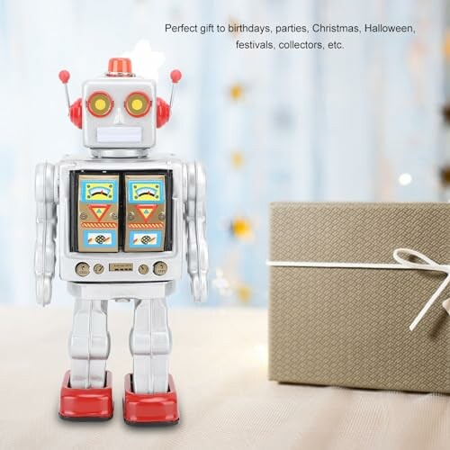 Vintage robot speelgoed naast een cadeau.