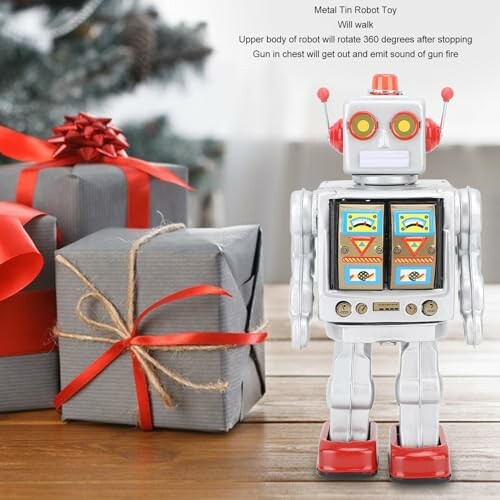 Vintage metalen robot met geschenken en kerstboom